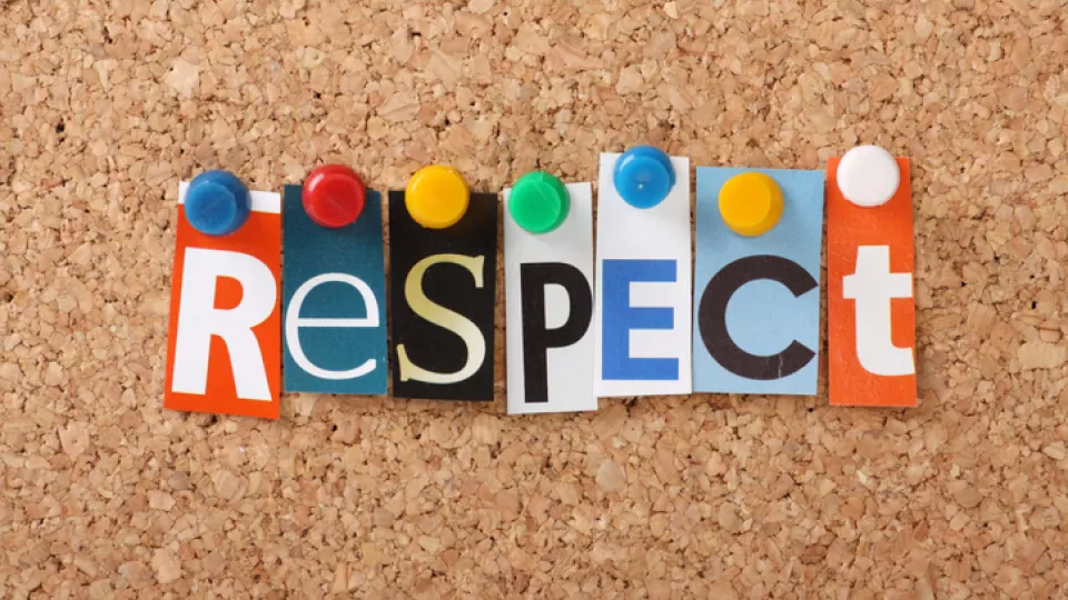 Cut out letters on cork board spelling respect. Photo. 
